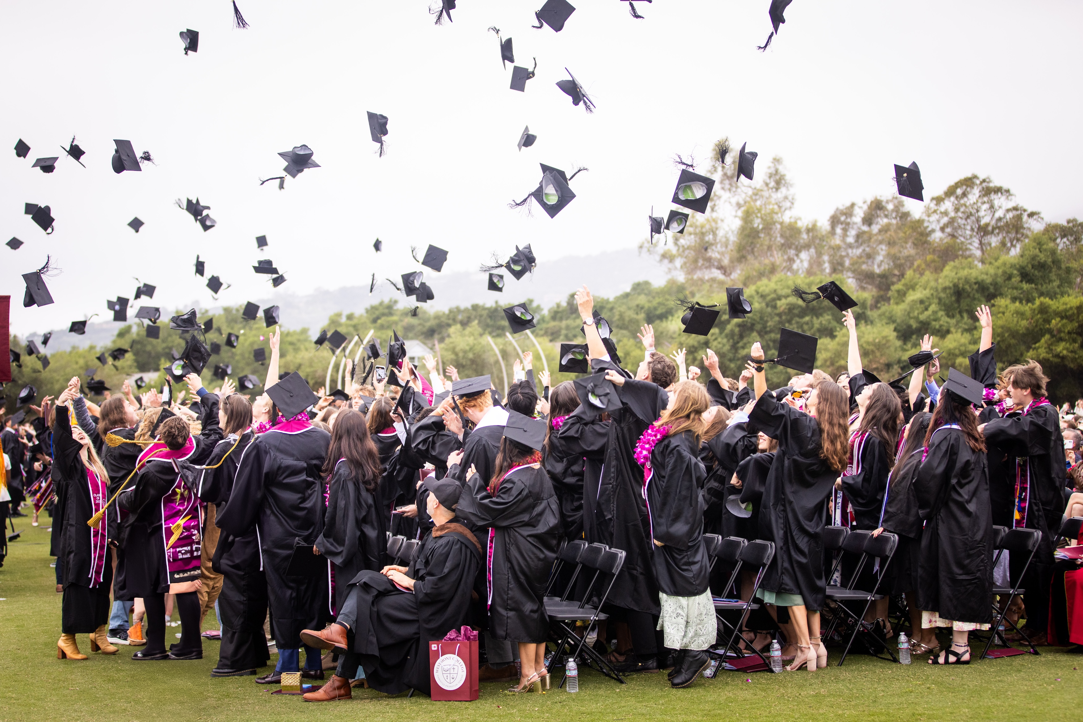 westmont Commencement 2025 students throwing caps in the air