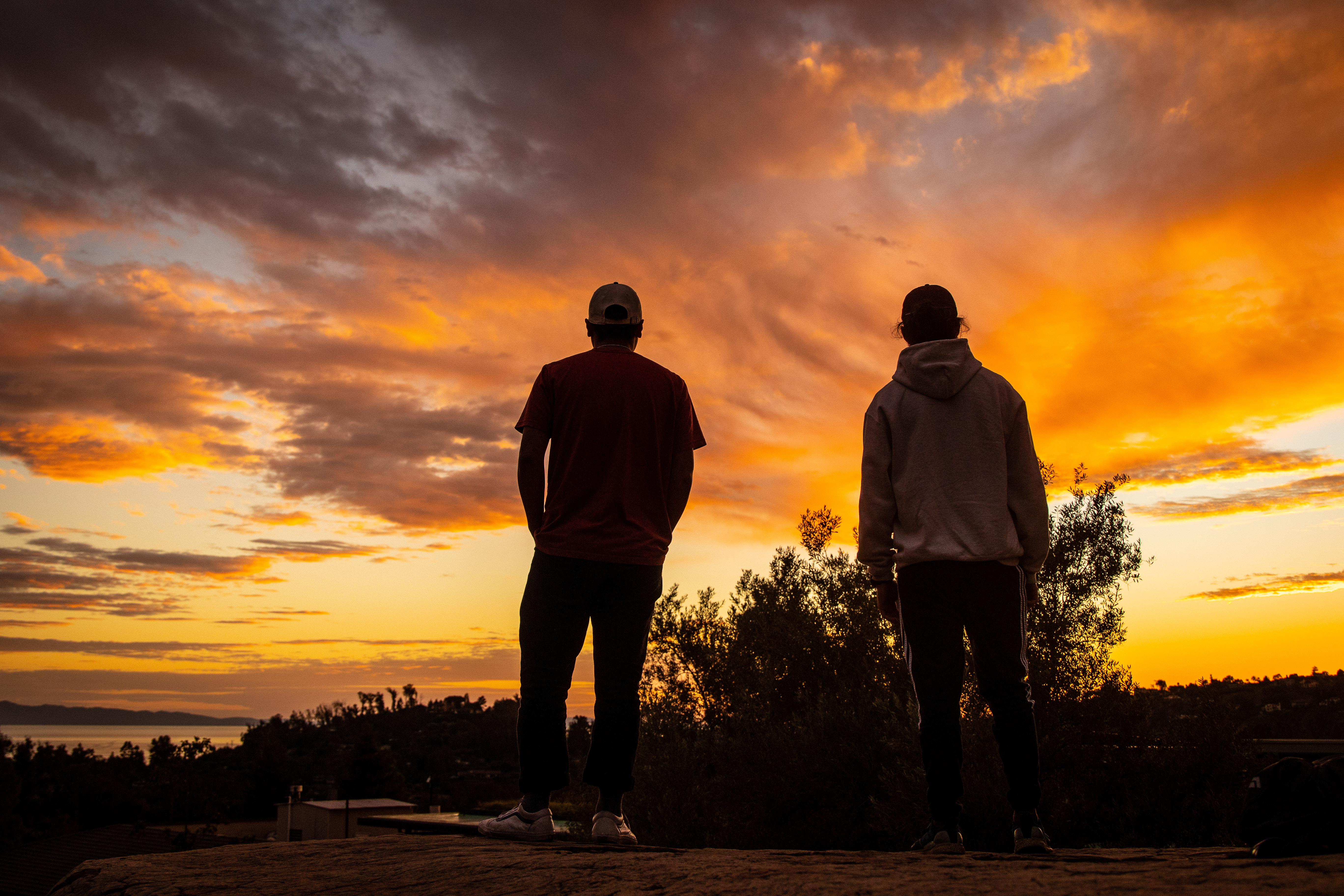 students standing at sunset