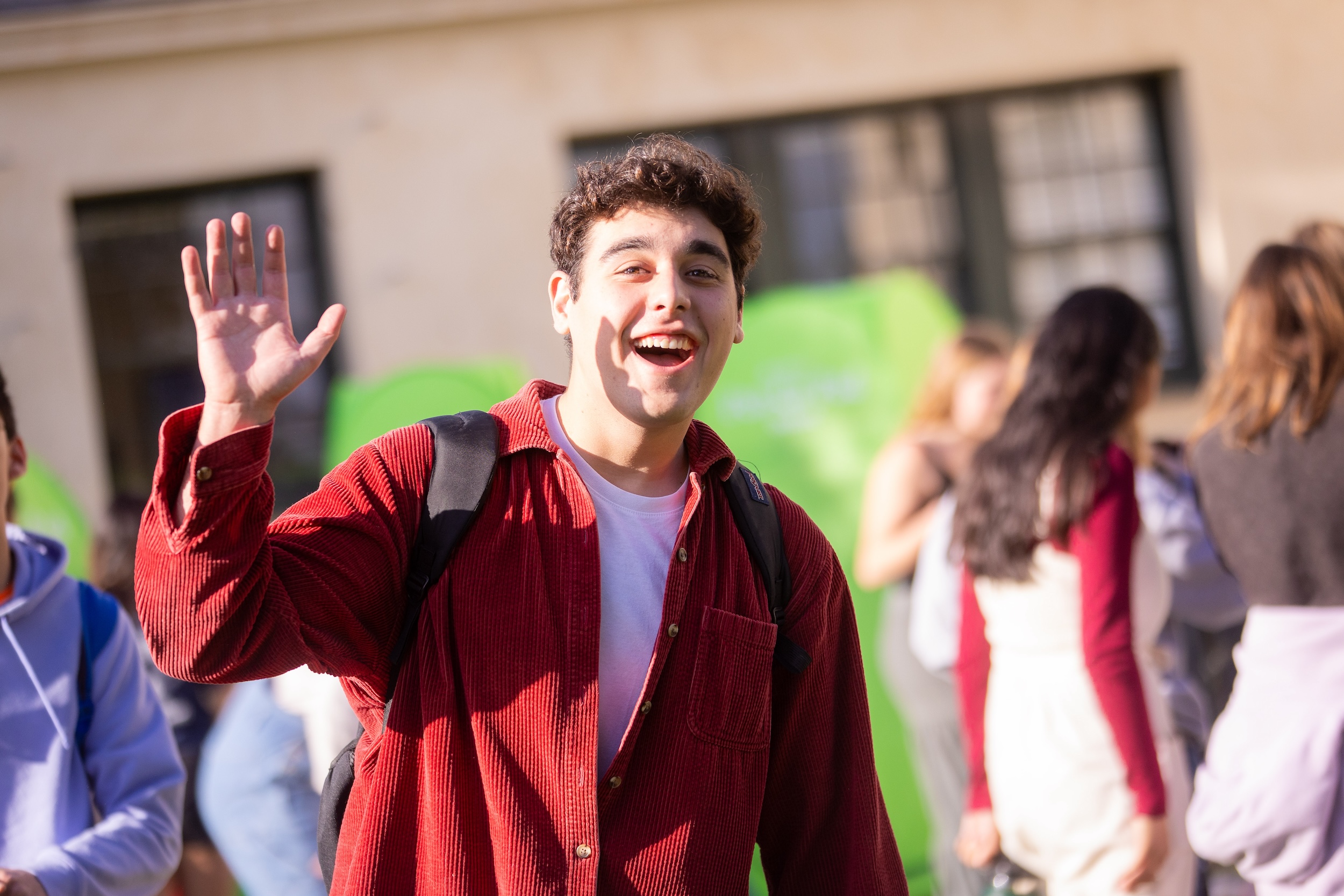 westmont student waving to the camera