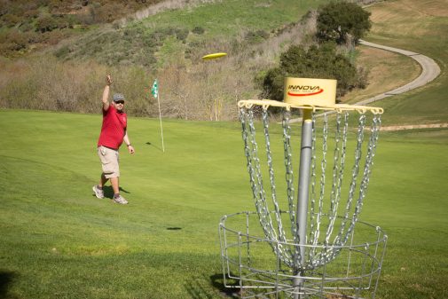 Alumnus Chris Atkinson '03 tosses a disc at Glen Annie