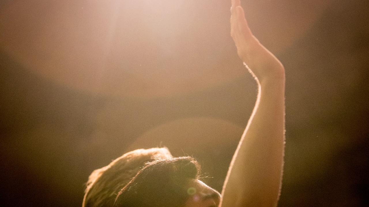 Student in chapel worshipping