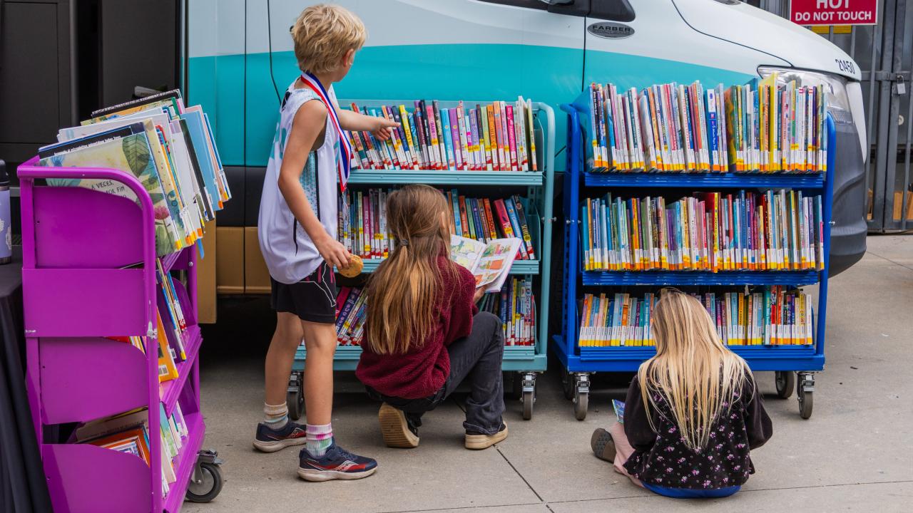 Children exploring the library bookmobile.
