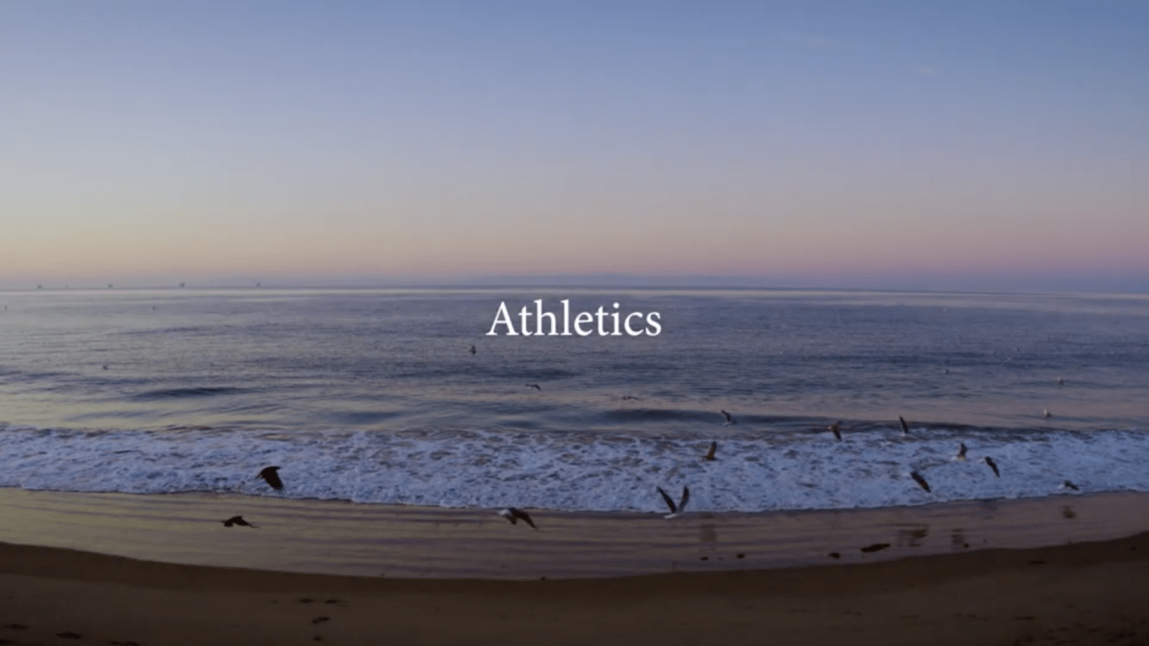A Westmont student running on the beach.