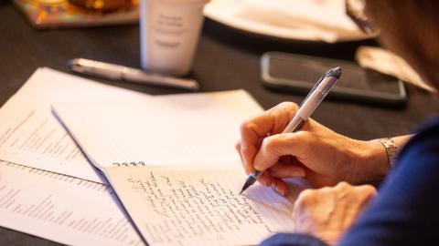 woman taking notes