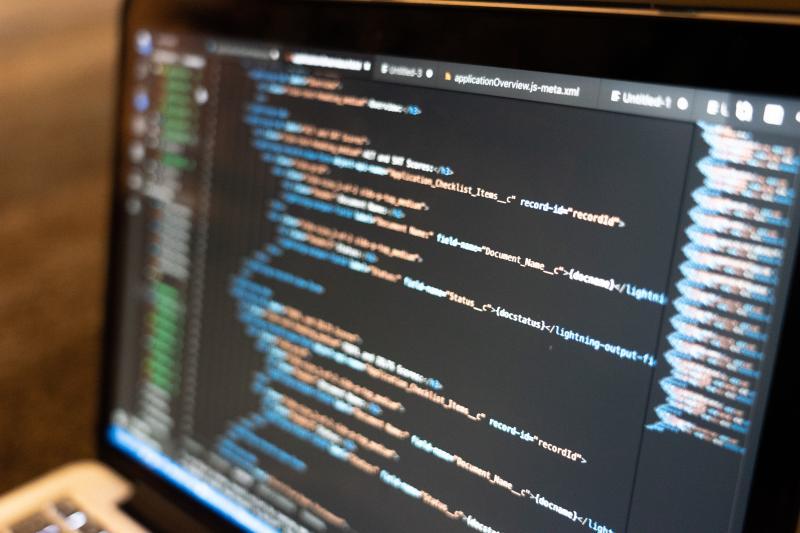 A close up shot of computer code on a laptop screen.
