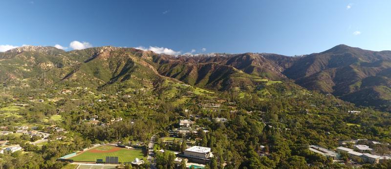 Aerial view of campus and mountains