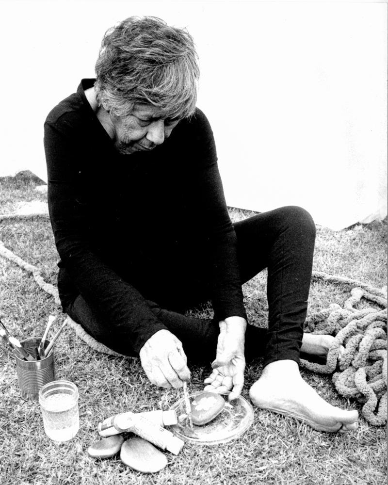 photo of figure sitting next to chains