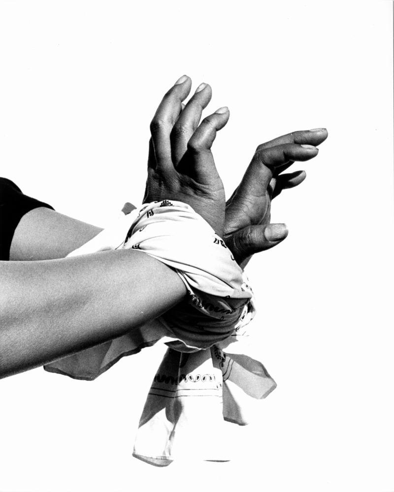 hands wrapped in scarf