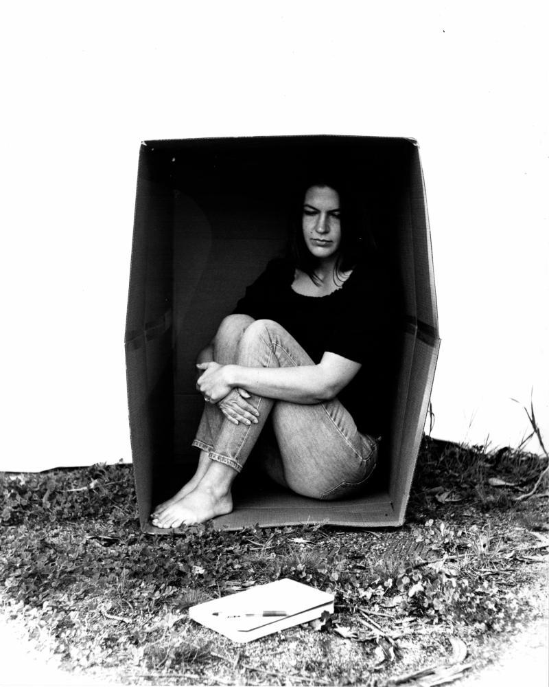 figure in cardboard box