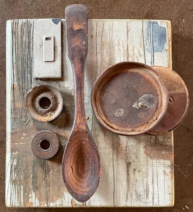 assemblage with spoon in center