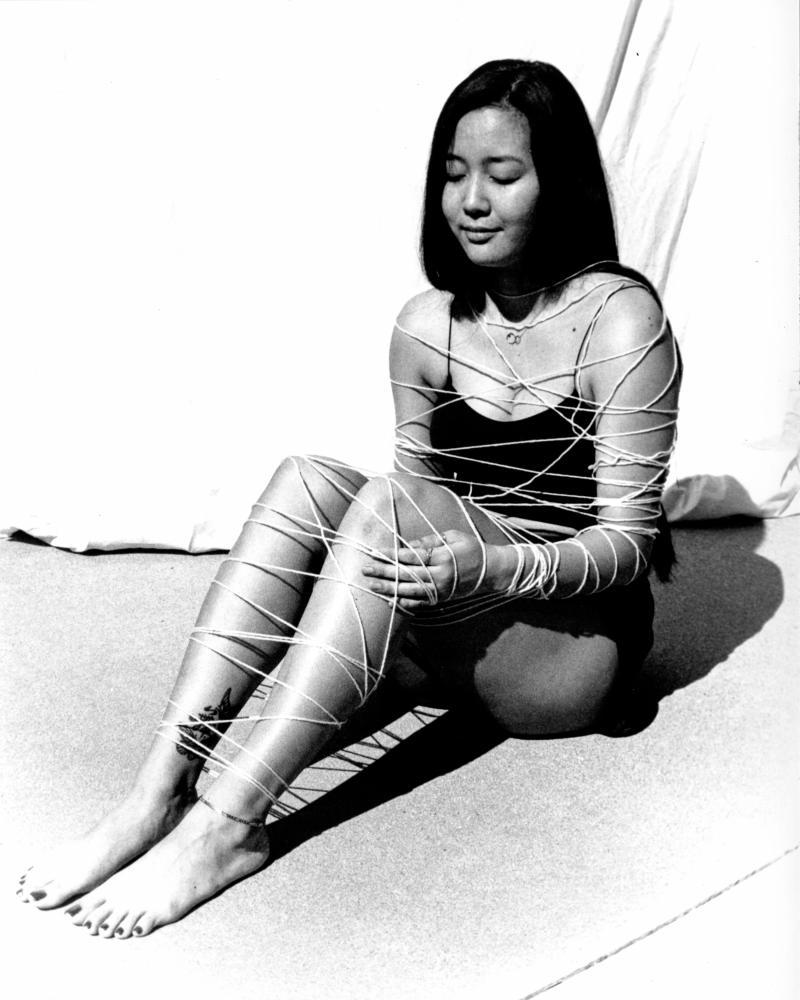 photo of figure wrapped in yarn