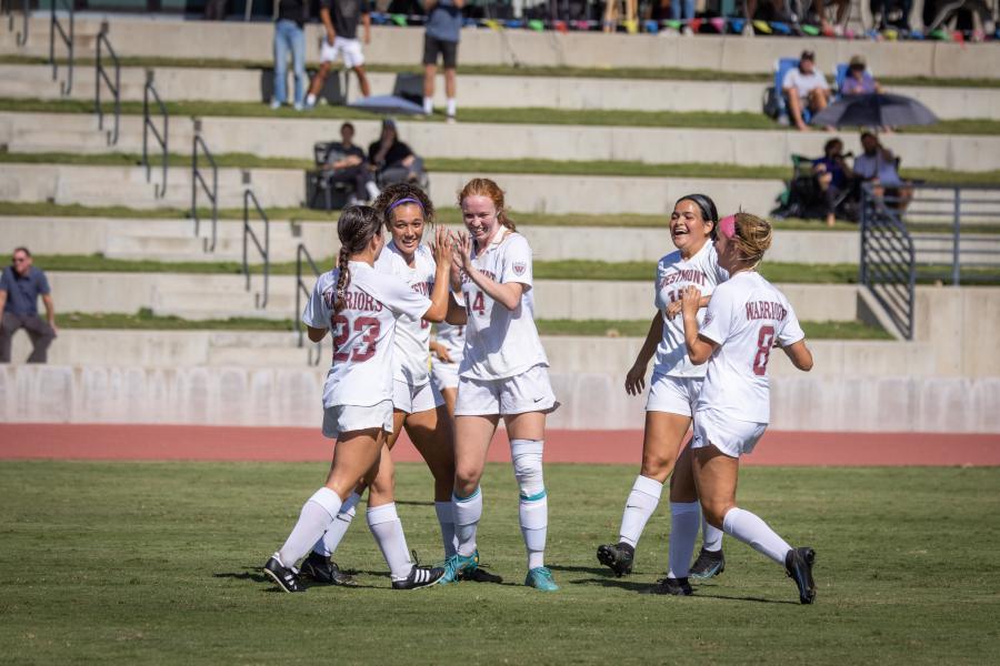 Women's soccer team celebrates a win