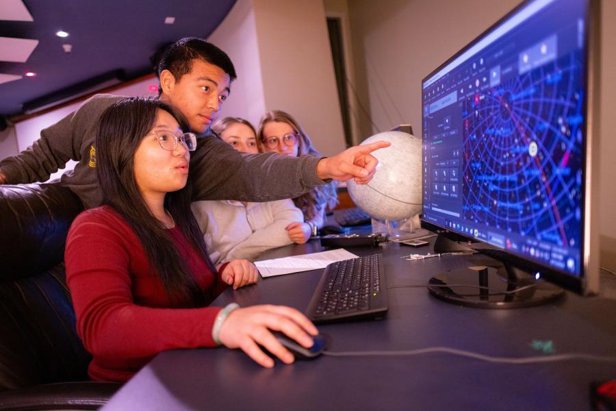 Westmont astronomy students use a computer to control the Keck Telescope