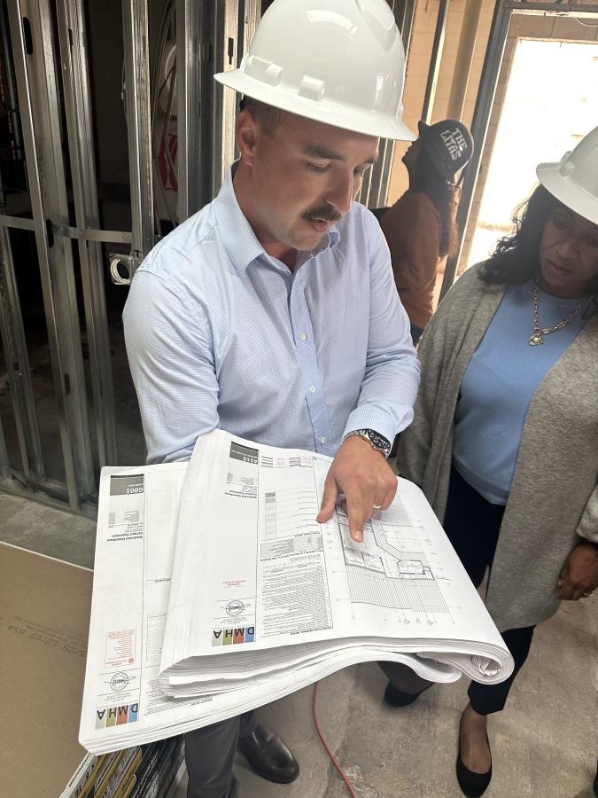 Filipp Kozachuk ‘14, project director for Tynan Group, oversees the work.