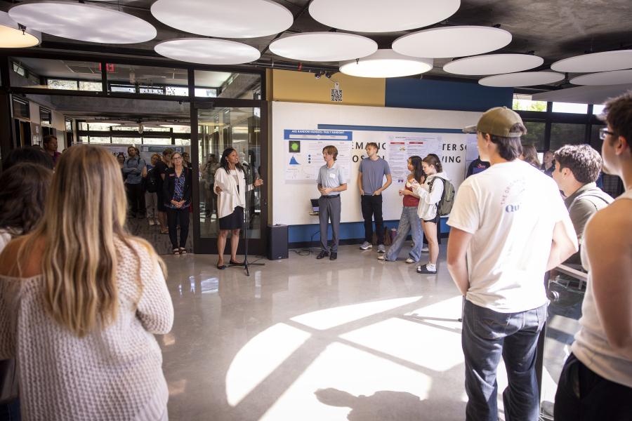 Provost Kim Denu speaks during the symposium 