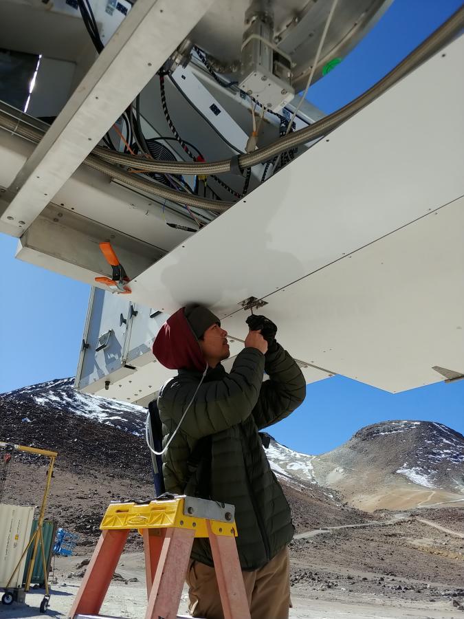 Student Michael Lew works on a telescope at 17,000 feet