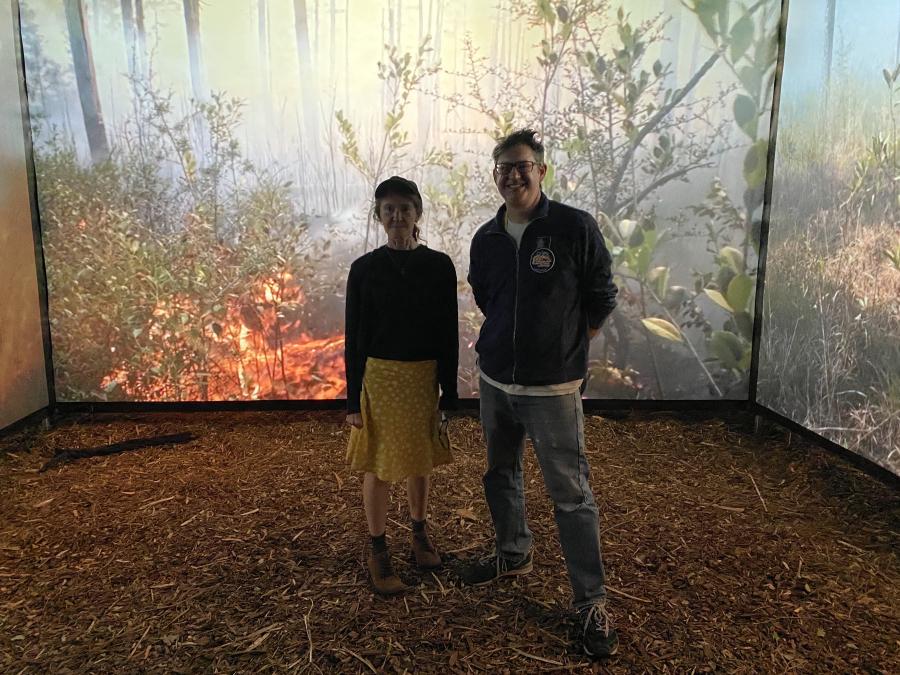 Ethan Turpin and Naomi Tague standing in "Burn Cave" smiling.
