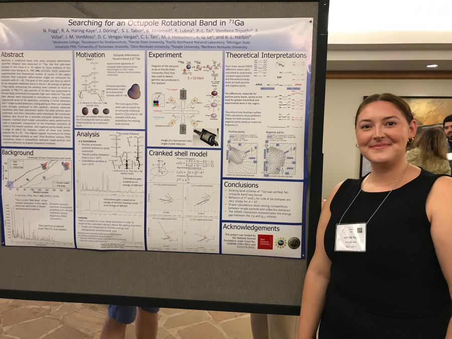Student Natalie Fogg explains her research at the Nuclear Physics Divisions of the American and Japanese Physics Societies 