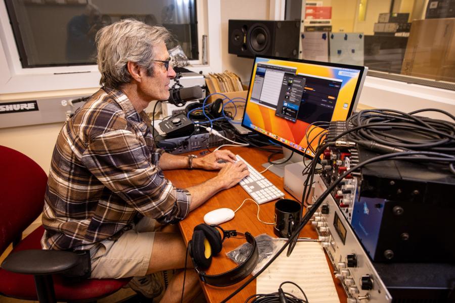 Jeff Aquilon, director of academic and institutional technology, installs new sound recording equipment