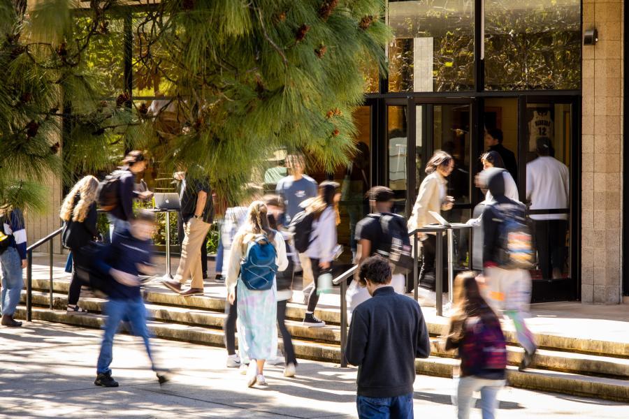 Time-lapse photo of students going into Murchison Gym for Chapel