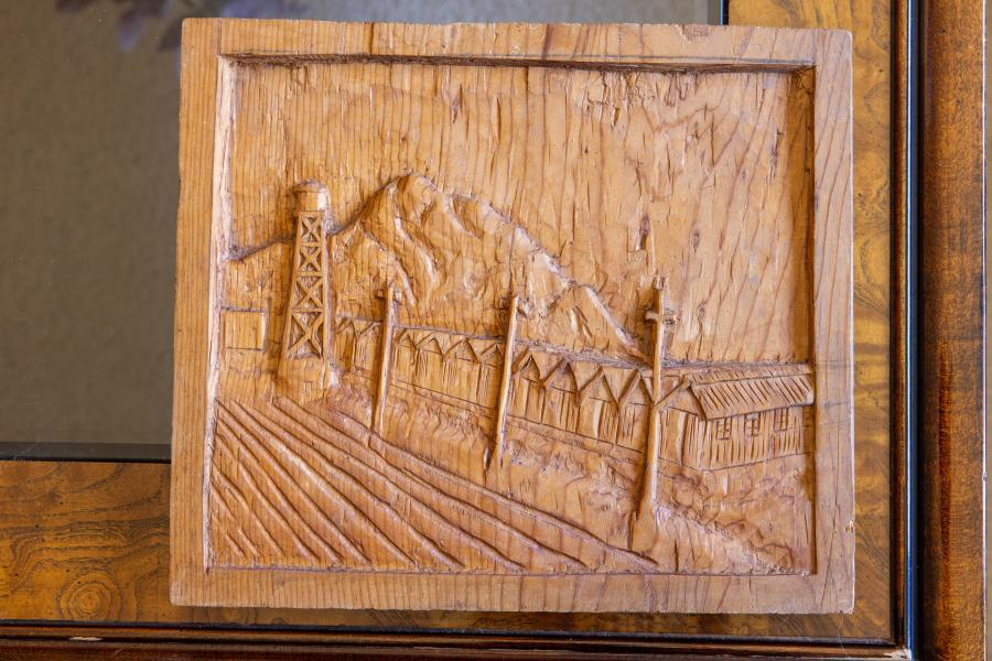 Paul’s grandfather carved the Poston barracks on some scrap wood from a fruit crate while incarcerated there.