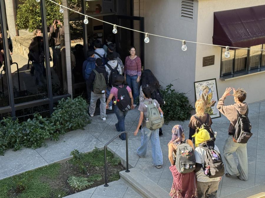 Students enter Porter Theatre for the performance