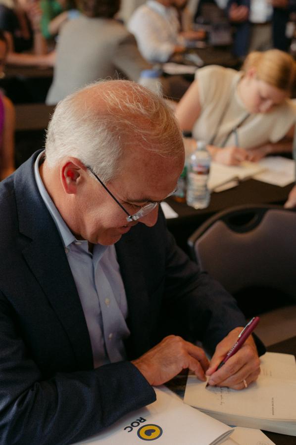 Brooks Signing a Book