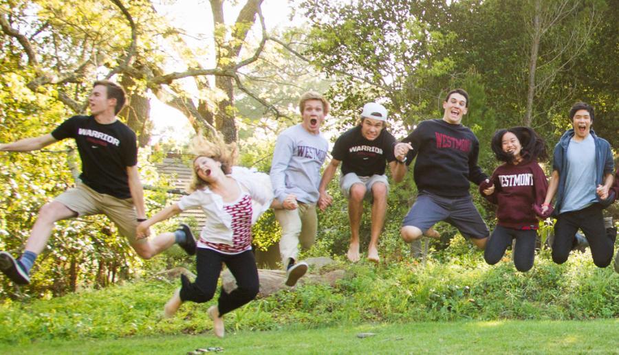 Students jumping crazily in air with joy.